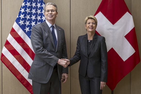 US Secretary of the Treasury Scott Bessent, left, shakes hands with Switzerland&#039;s President Karin Keller-Sutter, right, during a bilateral meeting between Switzerland and the United States, in Ge ...