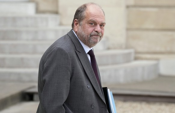 FILE - French justice minister Eric Dupond-Moretti walks out after the weekly cabinet meeting, at the Elysee Palace, in Paris, Wednesday, May 4, 2022. France&#039;s justice minister is on trial for al ...