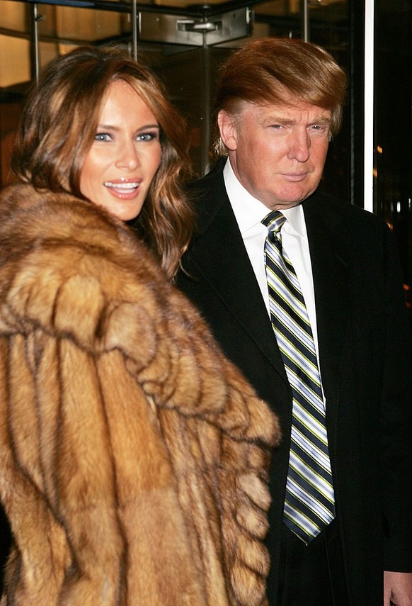 NEW YORK - DECEMBER 13: Businessman Donald Trump and his fiance Melania Knauss arrive at a gala to honor leaders in tourism sponsored by NYC &amp; Company at the Museum of Modern Art December 13, 2004 ...