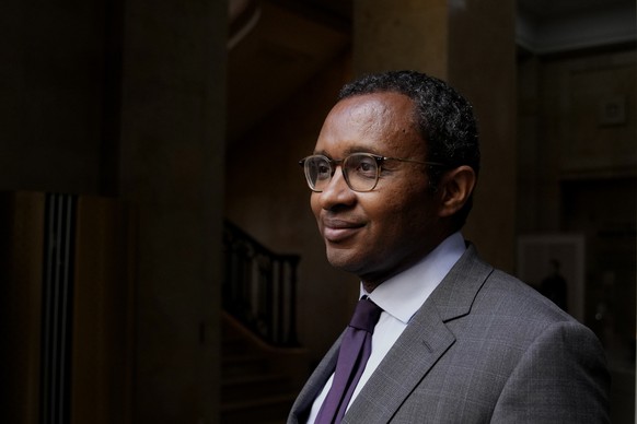 Newly named French education minister Pap Ndiaye poses during a handover ceremony in Paris, Friday, May 20, 2022. French President Emmanuel Macron has announced a new Cabinet. It includes a new foreig ...