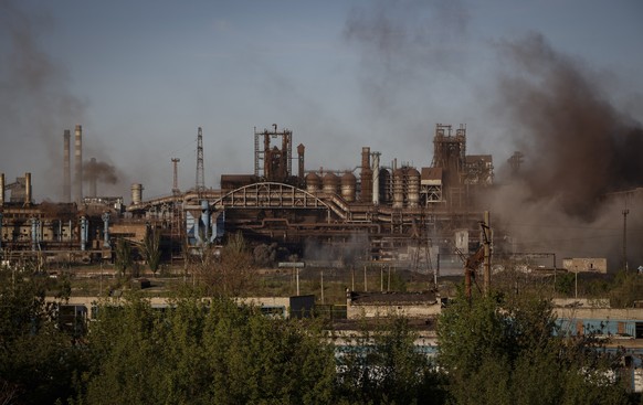 epa09932619 Smoke rises over Azovstal steel plant in Mariupol, Ukraine, 07 May 2022. According to the Interdepartmental Coordinating Headquarters of the Russian Federation for Humanitarian Response, 5 ...