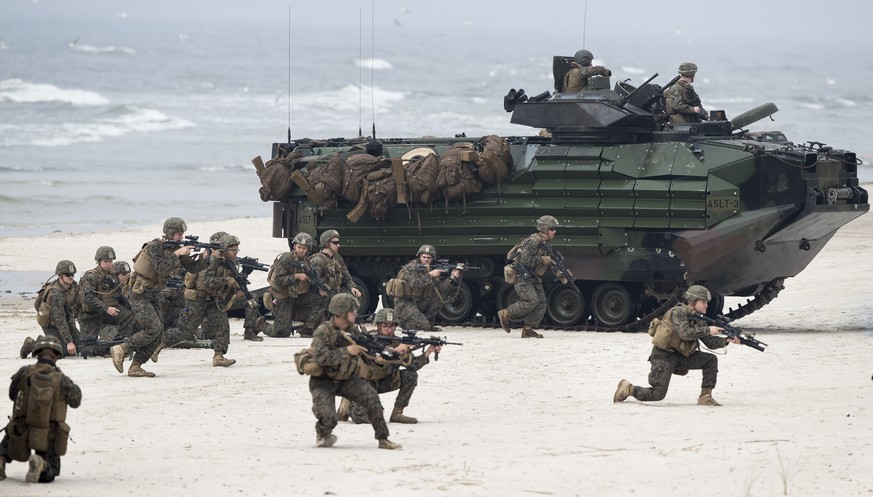 FILE - Marines take a part in a military exercise in the Baltic Sea near the village of Nemirseta, about 340 kilometers (211 miles) northwest of Vilnius, the capital of the former Soviet republic of L ...