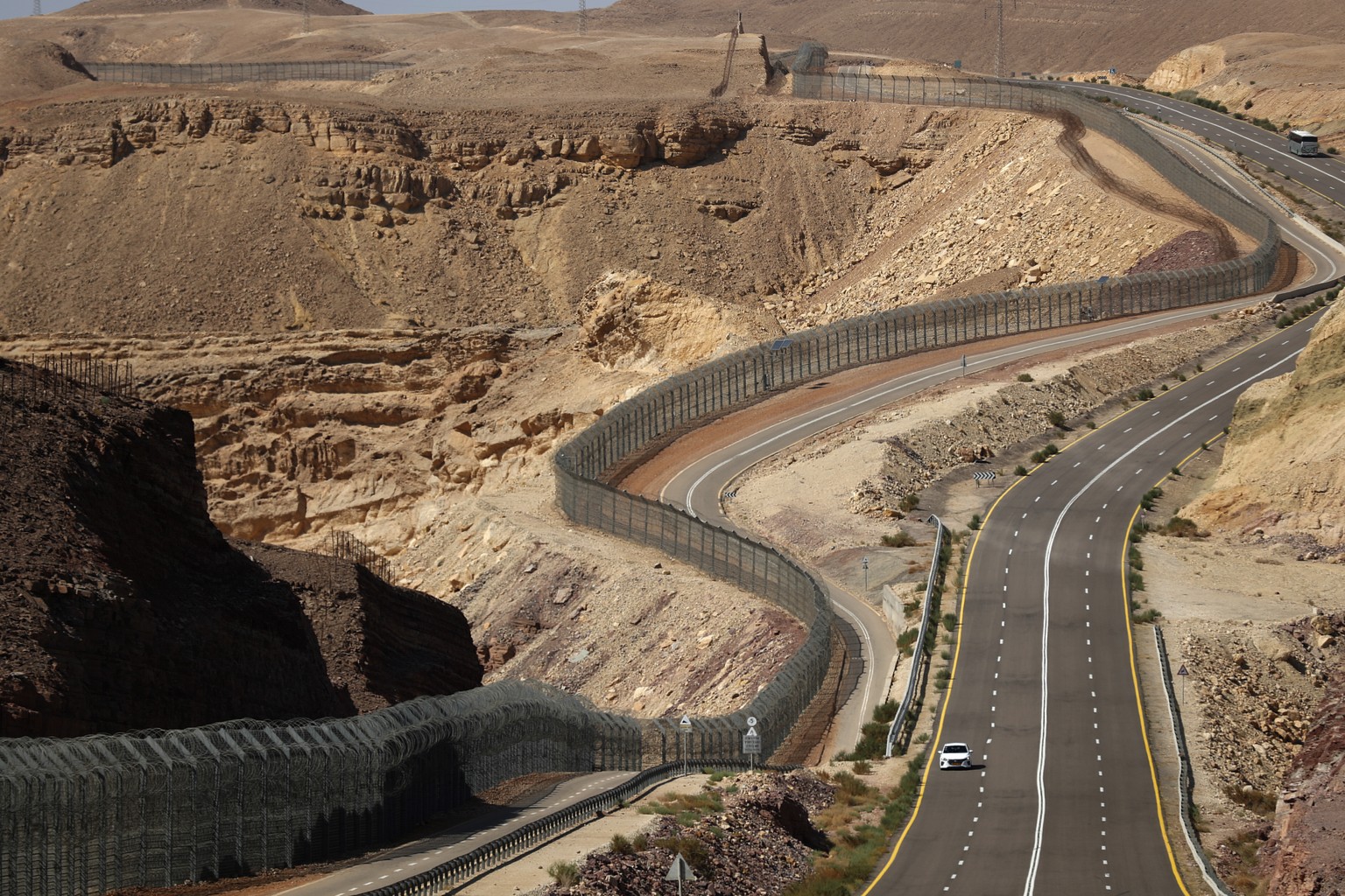 epa10685903 A fence runs along the Israeli-Egyptian border in the south of Israel, 11 June 2023. The border runs approximately 246 kilometers, from Rafah in the Gaza Strip to Eilat on the Red Sea. EPA ...