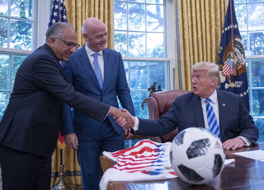August 28, 2018 - Washington, District of Columbia, U.S. - United States President Donald J. Trump, right, shakes hands with US Soccer President Carlos Cordeiro, left, as Gianni Infantino, center, Pre ...