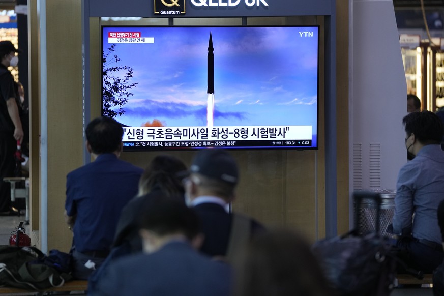 People watch a TV screen showing a news program reporting about North Korea's missile launch at a train station in Seoul, South Korea, Wednesday, Sept. 29, 2021. North Korea said Wednesday it suc ...