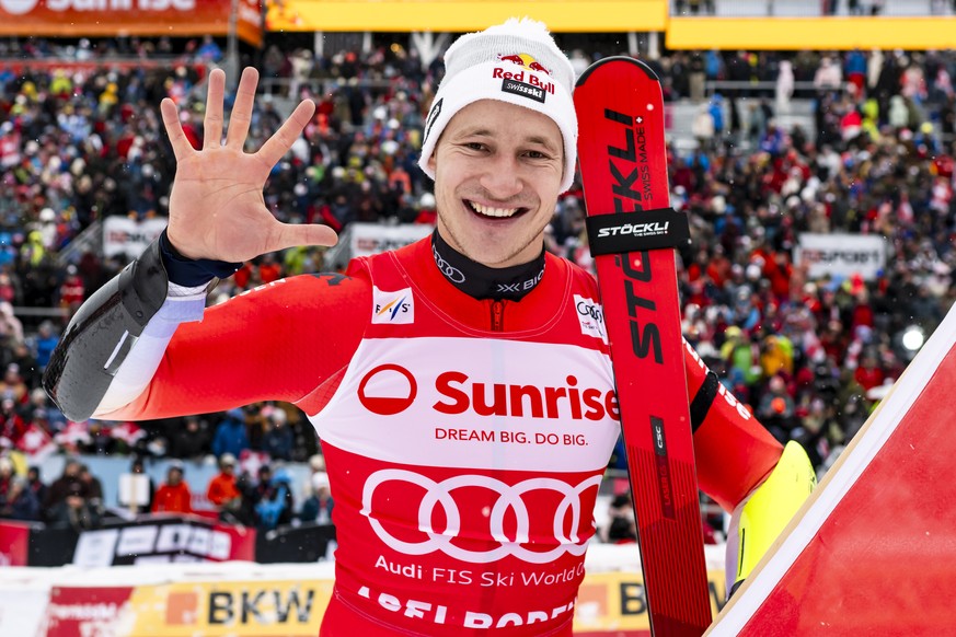 The winner Marco Odermatt of Switzerland celebrates during the podium of the men's Giant Slalom race at the Alpine Skiing FIS Ski World Cup, in Adelboden, Switzerland, Saturday, January 10, 2026. ...