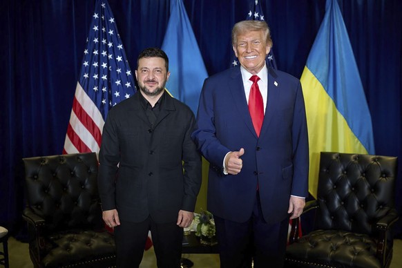 epa12400753 A handout photo made available by Ukrainian Presidential Press Service shows US President Donald J. Trump (R) and Ukrainian President Volodymyr Zelensky (L) meeting at the United Nations ( ...