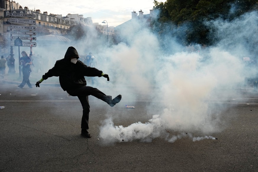 A protesters kicks a teargas canister during scuffles following a demonstration against under-resourced schools, in Paris, Tuesday, Oct. 6, 2026. (AP Photo/Teresa Suarez)
APTOPIX France School Protest ...