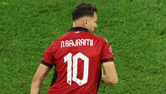 epa11435200 Ferran Torres (R) of Spain and Nedim Bajrami of Albania in action during the UEFA EURO 2024 group B soccer match between Albania and Spain, in Dusseldorf, Germany, 24 June 2024. EPA/GEORGI ...