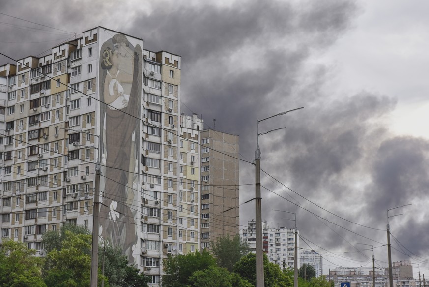 epa09996825 Smoke rises from a residential area in Kyiv (Kiev), Ukraine, 05 June 2022, amid the Russian invasion of the country. Kyiv Mayor Klitschko on 05 June announced on social media that several  ...