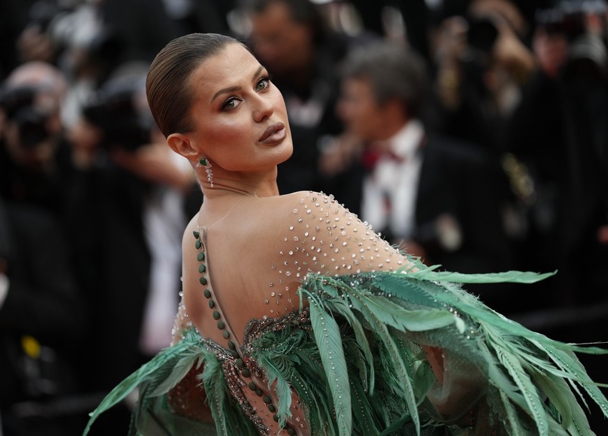 Victoria Bonya poses for photographers upon arrival at the opening ceremony and the premiere of the film 'Jeanne du Barry' at the 76th international film festival, Cannes, southern France, T ...