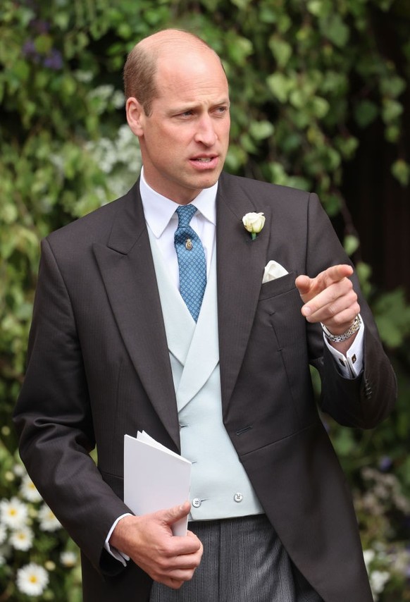 CHESTER, ENGLAND - JUNE 07: Prince William, Prince of Wales gestures after the wedding ceremony of Hugh Grosvenor, Duke of Westminster and Olivia Grosvenor, Duchess of Westminster at Chester Cathedral ...