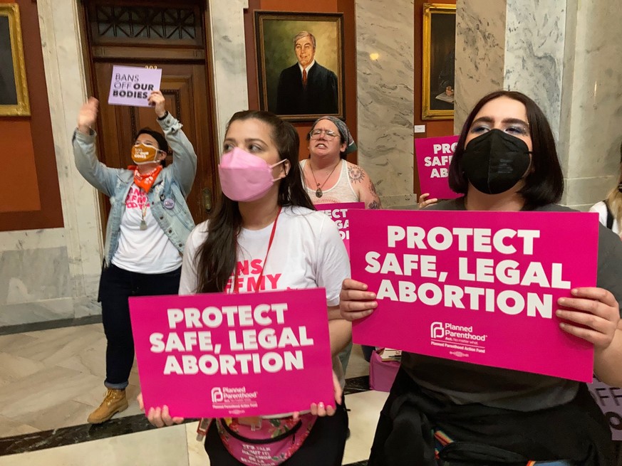 FILE - Abortion-rights supporters chant their objections at the Kentucky Capitol, April 13, 2022, in Frankfort, Ky. Abortion-rights groups filed a court motion on Tuesday, June 20, 2023, seeking to di ...