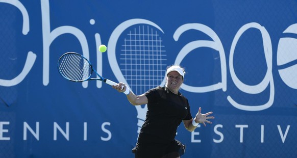 Kim Clijsters, of Belgium, hits a forehand against Su-Wei Hsieh, of Taiwan during her first round match in the Chicago Fall Tennis Classic tournament, Monday, Sept. 27, 2021, in Chicago. (AP Photo/Mat ...