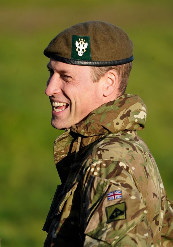 SALISBURY, ENGLAND - NOVEMBER 23: Prince William, Prince of Wales, Colonel-in-Chief, 1st Battalion Mercian Regiment (L) listens to a briefing ahead of an attack exercise during a visit to the regiment ...