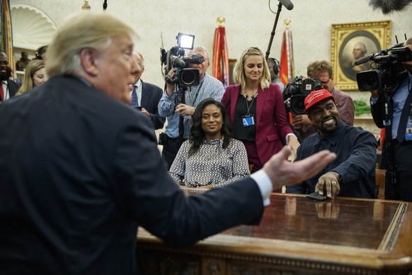President Donald Trump meets with rapper Kanye West in the Oval Office of the White House, Thursday, Oct. 11, 2018, in Washington. (AP Photo/Evan Vucci)