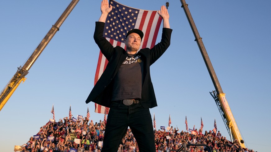 Tesla and SpaceX CEO Elon Musk walks to the stage to speak alongside Republican presidential nominee former President Donald Trump at a campaign event at the Butler Farm Show, Saturday, Oct. 5, 2024,  ...