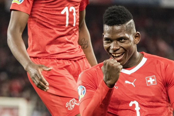 Swiss Breel Embolo celebrates after scoring to 3:0 during the UEFA Euro 2020 qualifying Group D soccer match between Switzerland and Denmark, at the St. Jakob-Park stadium in Basel, Switzerland, Tuesd ...