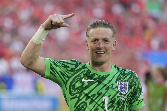 England&#039;s goalkeeper Jordan Pickford celebrates after the penalty shootout of a quarterfinal match between England and Switzerland at the Euro 2024 soccer tournament in Duesseldorf, Germany, Satu ...