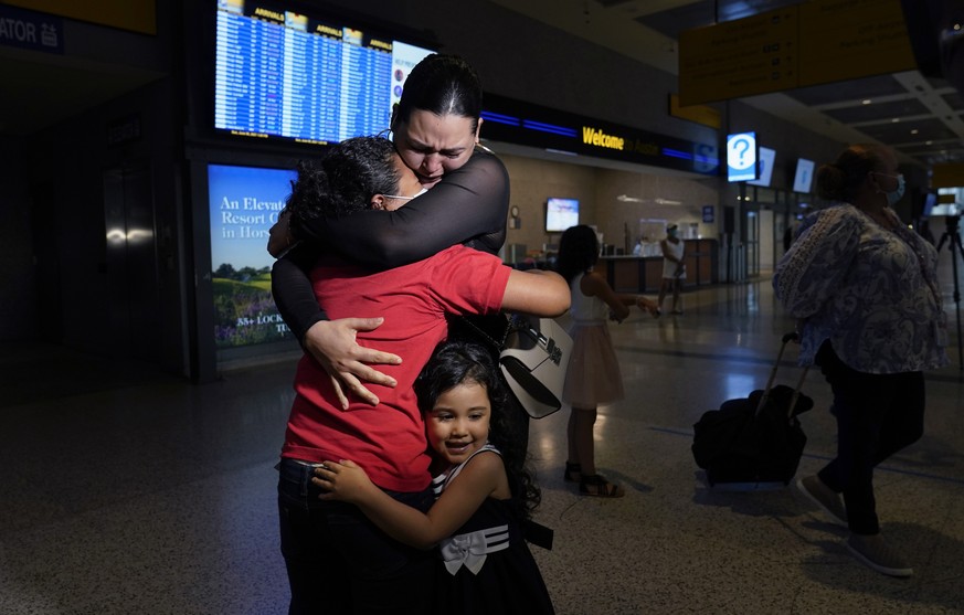 FILE - In this June 6, 2021, file photo, Emely, left, is reunited with her mother, Glenda Valdez and sister, Zuri, at Austin-Bergstrom International Airport in Austin, Texas. It had been six years sin ...