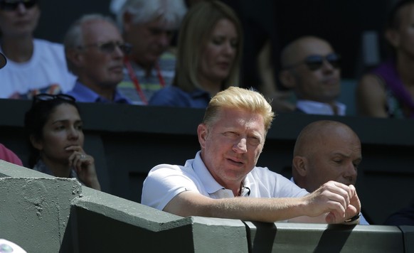 Boris Becker, coach of Novak Djokovic of Serbia, watches his match against Grigor Dimitrov of Bulgaria from the players box during their men&#039;s singles semifinal match at the All England Lawn Tenn ...