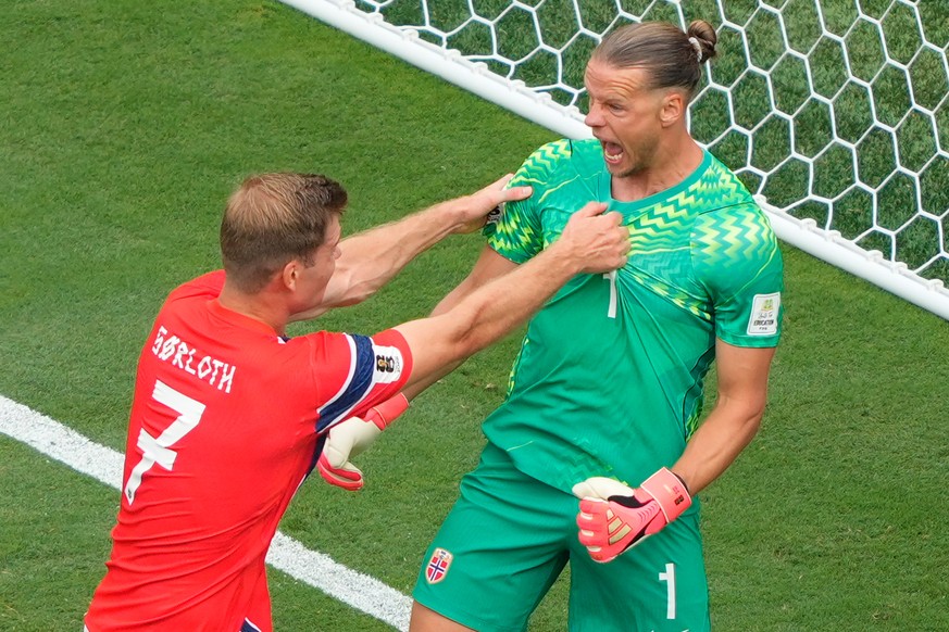 Norway's Alexander Soerloth (7) and goalkeeper Oerjan Nyland (1) react after after a saved penalty kick during the World Cup round of 16 soccer match between Brazil and Norway in East Rutherford, ...