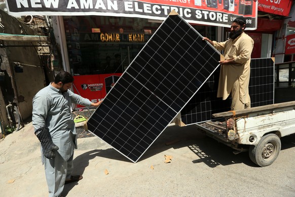epa12046668 Solar panels for sale at a market on Earth Day in Peshawar, Khyber Pakhtunkhwa province, Pakistan, 22 April 2025. The theme for Earth Day 2025 is 'Our Power, Our Planet,' urging  ...