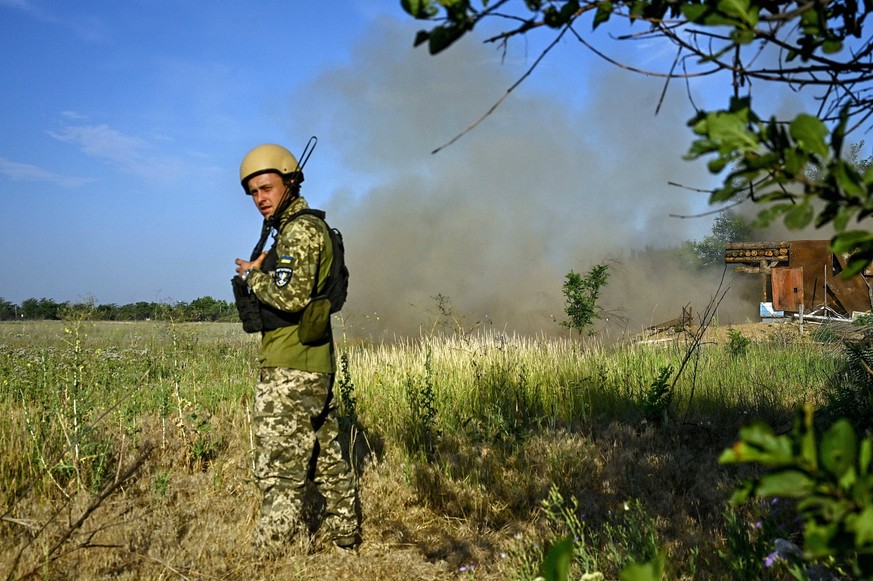 Artillery crews of 65th Brigade destroy Russian occupiers in Zaporizhzhia region ZAPORIZHZHIA REGION, UKRAINE - JULY 12, 2024 - An artillery crew of the 65th Mechanized Brigade fires a 2S3M self-prope ...