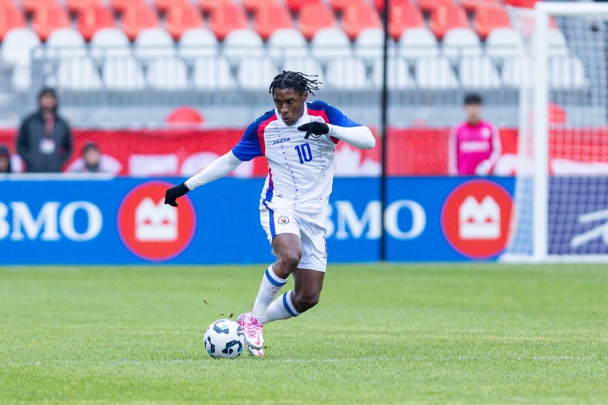 Haiti midfielder Jean-Ricner Bellegarde #10 carries the ball during an international friendly match between Haiti and Iceland at BMO Field in Toronto, Ontario, Canada, on March 31, 2026. (Photo by Ind ...