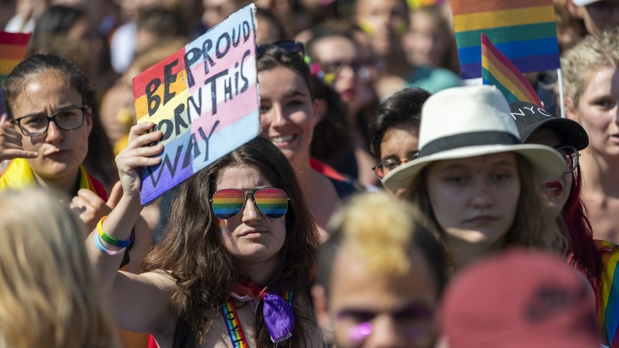 People participate in the Pride March LGBTQ + Pride (Lesbian, Gay, Bi, Trans and more), in Geneva, Switzerland, Saturday, July 06, 2019. (KEYSTONE/Martial Trezzini)