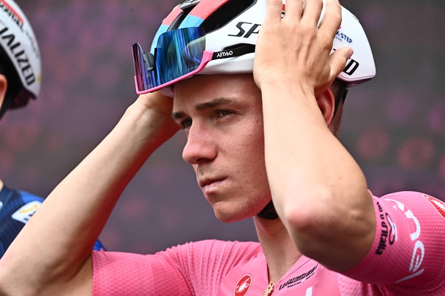 epa10615164 Belgian rider Remco Evenepoel of team Soudal Quick-Step wearing the overall leader&#039;s pink jersey looks on ahead of the third stage of the 2023 Giro d&#039;Italia cycling race over 213 ...