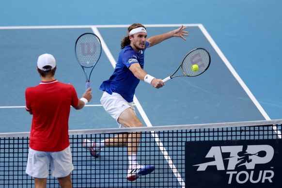 epa10388424 Stefanos Tsitsipas of Greece in action against Borna Coric of Croatia during the 2023 United Cup City Final tennis match between Greece and Croatia at RAC Arena in Perth, Western Australia ...