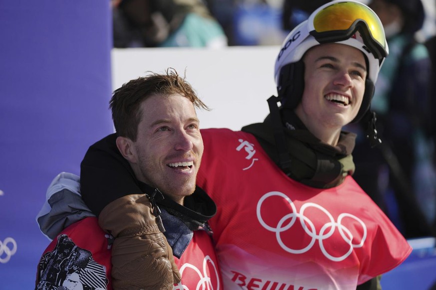 United States&#039; Shaun White, left, and Switzerland&#039;s Jan Scherrer watches during the men&#039;s halfpipe finals at the 2022 Winter Olympics, Friday, Feb. 11, 2022, in Zhangjiakou, China. (AP  ...