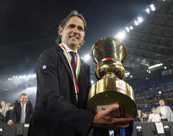 Inter Milan&#039;s coach Simone Inzaghi, celebrates after the team&#039;s victory at the Italian Cup final soccer match between Fiorentina and Inter Milan at the Rome&#039;s Olympic Stadium, Wednesday ...