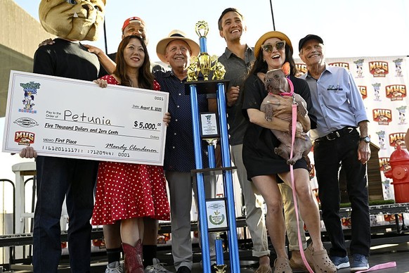 SONOMA COUNTY, CALIFORNIA - AUG 8: Petunia was crowned as the winner of the 2025 &#039;World&#039;s Ugliest Dog&#039; contest with her owner Shannon Nyman by her side and was awarded $5,000 on August  ...