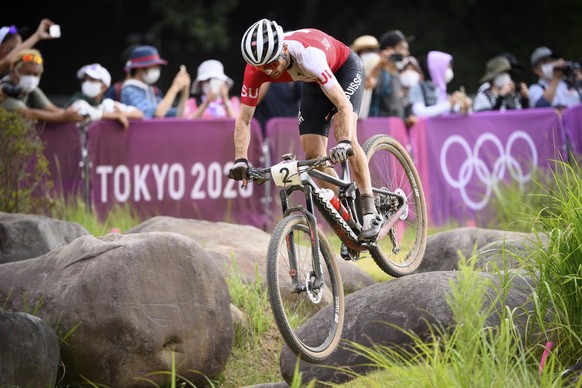 Mathias Flueckiger of Switzerland competes during the men&#039;s Cross-country Mountain Bike, MTB, race at the 2020 Tokyo Summer Olympics in Izu near Tokyo, Japan, on Monday, July 26, 2021. (KEYSTONE/ ...