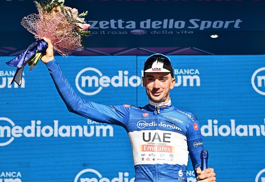 epa10612564 US rider Brandon Mcnulty of UAE team Emirates celebrates on the podium wearing the best climber&#039;s blue jersey after the first stage of the 2023 Giro d&#039;Italia cycling race, a time ...