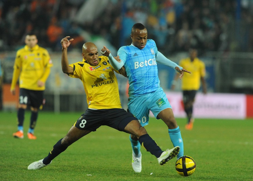 French First League soccer match, Sochaux vs Olympique de Marseille Marseille s player Andre Ayew fights for the ball with Sochaux s Carlao during French First League soccer match, FC Sochaux vs Olymp ...