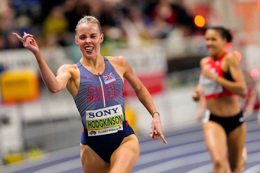 Keely Hodgkinson, of Britain, crosses the finish line to win the gold medal in the women's 800 meters final at the World Athletics Indoor Championships in Torun, Poland, Sunday, March 22, 2026. ( ...
