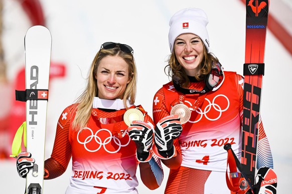Gold medalist Lara Gut-Behrami of Switzerland, left, celebrates with bronze medalist Michelle Gisin of Switzerland, right, during the victory ceremony of the women&#039;s Alpine Skiing Super-G race at ...