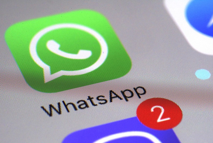 FILE - This Friday, March 10, 2017 file photo shows the WhatsApp communications app on a smartphone, in New York. A German privacy regulator banned Facebook on Tuesday May 11, 2021, from gathering dat ...