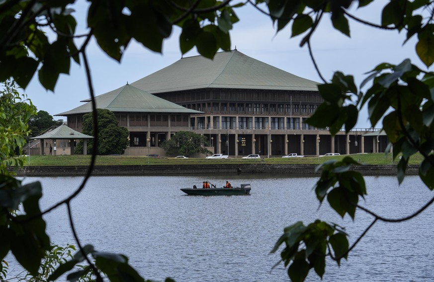 Army soldiers patrol in a boat outside the parliament building in Colombo, Sri Lanka, Saturday, July 16, 2022. Sri Lankan lawmakers met Saturday to begin choosing a new leader to serve the rest of the ...