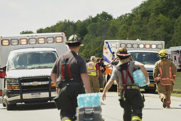 Rescue personnel work the scene of a tour bus that crashed and rolled over on the New York State Thruway near Pembroke, N.Y., Friday, Aug. 22, 2025. (Libby March/Buffalo News via AP)
NY Bus Crash