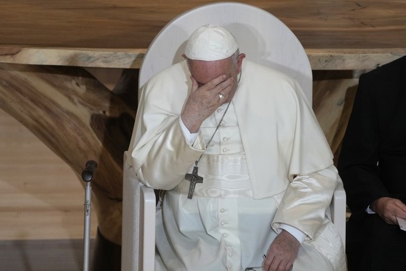 Pope Francis sits during a meeting with Indigenous peoples and members of the parish community of Sacred Heart in Edmonton, Canada, Monday, July 25, 2022. Pope Francis begins a &quot;penitential&quot; ...