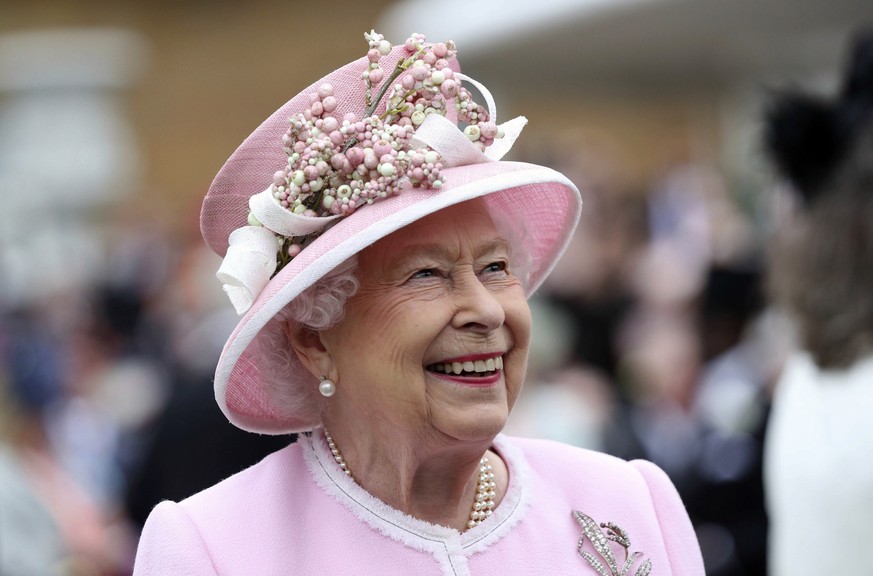 FILE - Britain&#039;s Queen Elizabeth arrives for a Royal Garden Party at Buckingham Palace in London, Wednesday, May 29, 2019. Queen Elizabeth II will miss the traditional royal garden party season,  ...