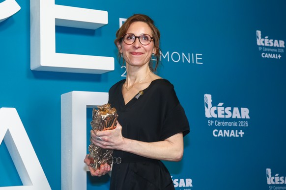 epa12780327 Carine Tardieu winner of the Best Film Award for 'L'attachement' poses in the press room during the 51st annual Cesar awards ceremony held at the Olympia concert hall in Par ...