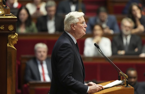 French Prime Minister Michel Barnier delivers his speech at the National Assembly while France&#039;s minority government may be on its last legs as opposition lawmakers moved this week toward a no-co ...