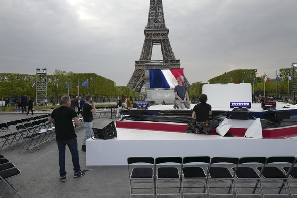 The stage is being prepared in front of the Eiffel Tower for centrist incumbent French President Emmanuel Macron&#039;s address on election night in Paris, France, Sunday, April 24, 2022. France voted ...