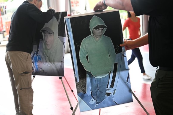 KENNETT SQUARE, PENNSYLVANIA - SEPTEMBER 10: Photographs of escaped murderer Danelo Cavalcante taken on the night of September 9 from a door camera are prepared for display before a press conference w ...