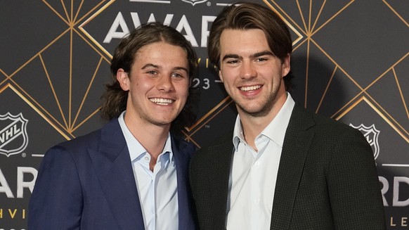New Jersey Devils hockey players Jack Hughes, left, and Nico Hischier, right, pose on the red carpet before the NHL Awards, Monday, June 26, 2023, in Nashville, Tenn. (AP Photo/George Walker IV)